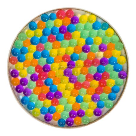 Hydrogel colored transparent balls orbeez, colorful background. Top view.