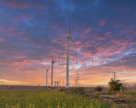 Foto de Wind turbines with beautiful sunset sky, zorlu energy wind turbines installed in jhampir near gharo sindh Pakistan. renewable energy, green energy - Imagen libre de derechos