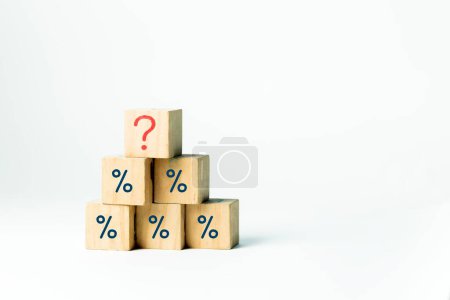 Financial symbols, wooden blocks of blue percentage symbol showing question mark