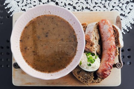 Photo for Pea Puree with Sausage, Bread and Boiled Egg, top view - Royalty Free Image