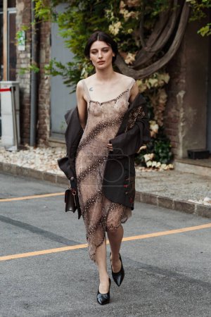Photo for Alice Pagani wears all Antonio Marras, outside Antonio Marras show during Milan Fashion Week Womenswear Spring/Summer 2024. - Royalty Free Image