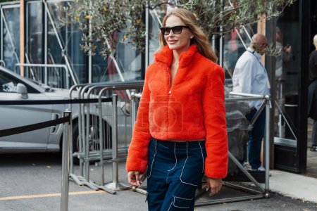 Photo for Ginta wears red fur jacket, outside Antonio Marras show during Milan Fashion Week Womenswear Spring/Summer 2024. - Royalty Free Image