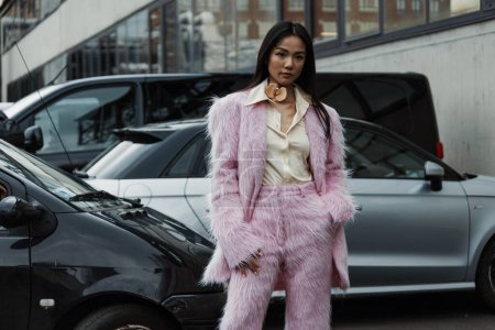 Photo for Yoyo Cao wears fur pink suit, outside Sportmax show during Milan Fashion Week Womenswear Spring/Summer 2024. - Royalty Free Image