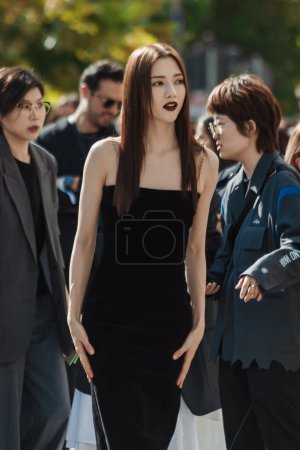 Photo for Naran wears midi black dress, outside Salvatore Ferragamo show during Milan Fashion Week Womenswear Spring/Summer 2024. - Royalty Free Image