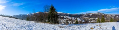 Photo for Sun over snowy Nord-East slopes of Polonina Borzhava from Izky village, Carpathian mountains, Ukraine - Royalty Free Image