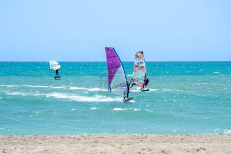 Photo for TORREMOLINOS, SPAIN - MAY 28, 2023: Surfers on beach in Torremolinos, Spain on May 28, 2023 - Royalty Free Image