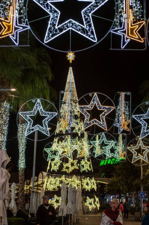 Photo for TORREMOLINOS, SPAIN - DECEMBER 14, 2023: Capture the festive charm of the Christmas lights and tree in Torremolinos, Spain on December 15, 2023 - Royalty Free Image