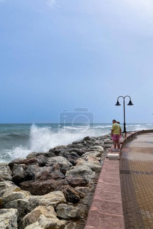 Sea storm on wharf in Torremolinos, Spain