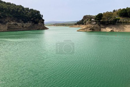 Lake Embalse conde de Guadalhorce on sunny day in El Chorro, Malaga, Spain
