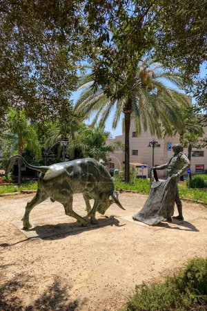 Photo for ESTEPONA, SPAIN - JULY 29, 2023: Toreador and bull statue in front of the bullring in Estepona, Spain on July 29, 2023 - Royalty Free Image