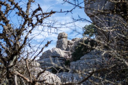 Hiking in the Torcal de Antequerra National Park, limestone rock formations and known for unusual karst landforms in Andalusia, Malaga, Spain.