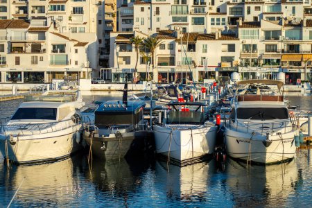 Photo for BANUS, SPAIN - MARCH 16, 2024: Yachts marina on sunrise in Banus, Marbella, Spain on March 16, 2024 - Royalty Free Image