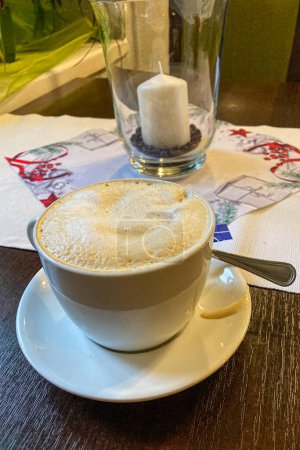 Photo for Tasty cappuccino in restaurant, Christmas time - Royalty Free Image