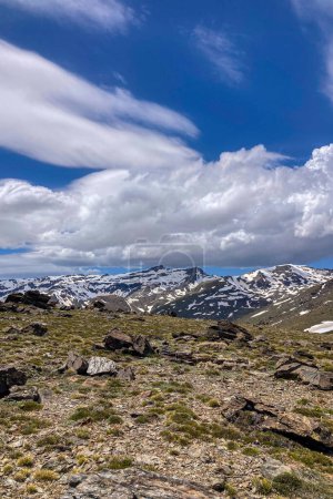Panoramic view on snowy mountains on hiking trail to Mulhacen peak in the spring, Sierra Nevada range, Andalusia, Spain