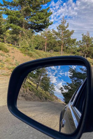 Road reflected in car's mirror to Parking Hoya del Portillo, Sierra Nevada range, Andalusia, Spain