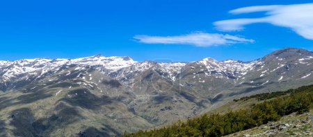 Photo for Panoramic view on snowy mountains on hiking trail to Mulhacen peak in the spring, Sierra Nevada range, Andalusia, Spain - Royalty Free Image