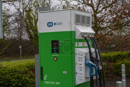 Photo for Lusk, County Dublin, Ireland, 29th March 2023. ESB E Car charge point in parking lot for electric and hybrid vehicles - Royalty Free Image