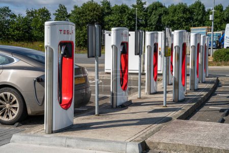 Photo for Castlebellingham, County Louth, Ireland, 26th June 2023. Tesla Supercharger charge point in parking bay for electric vehicle - Royalty Free Image