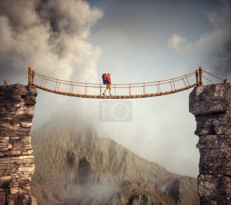 Téléchargez les photos : Randonneur marchant sur un pont suspendu entre les montagnes. C'EST UNE ILLUSTRATION DE RENDER 3D. - en image libre de droit