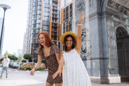 Photo for Portrait of two young beautiful smiling hipster female in trendy summer clothes.Sexy carefree women posing on street background. - Royalty Free Image