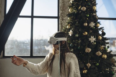 Photo for A sunny winter morning setting: a bright young woman with a virtual reality headset. High quality photo - Royalty Free Image