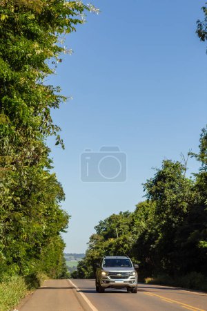 Photo for A beautiful and tree-lined stretch of the GO-156 Highway in the state of Goias. Brazil. - Royalty Free Image