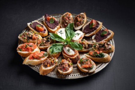 Photo for Delicious canapes with chopped vegetables, cream cheese, meat pate - Royalty Free Image