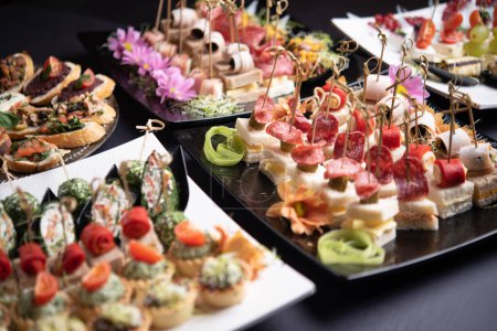 Photo for Platters of festive antipasti, luxurious finger food - Royalty Free Image