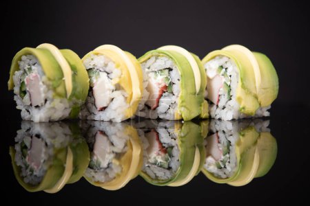 Photo for Sushi rolls with avocado and crab meat - Royalty Free Image