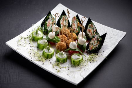 Photo for Tiny canapes and falafels served with skewers - Royalty Free Image