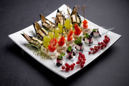 Photo for Vegetarian canapes served with skewers - Royalty Free Image