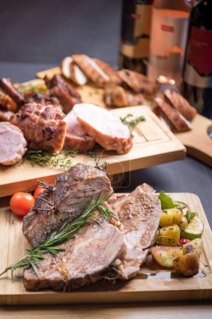 Photo for Festive meat dishes served on boards - Royalty Free Image