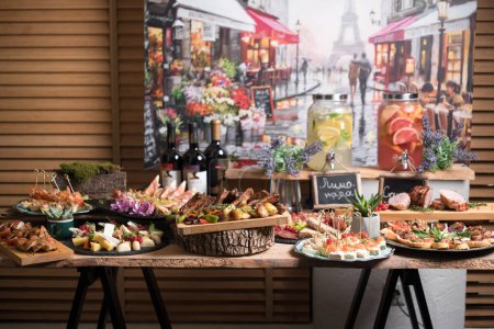 Photo for Amazing holiday table with variety of finger food and drinks served in Provence style - Royalty Free Image