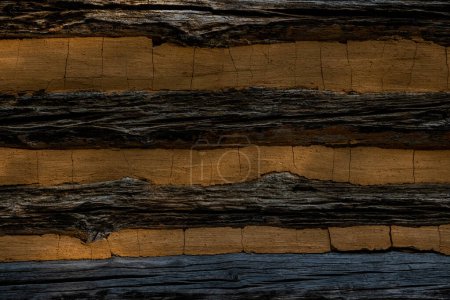 Photo for Log House Wall In Shadow along side of historic building - Royalty Free Image