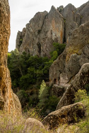 Photo for Trail Cuts Through Tunnel Below The Rocks In Pinnacles National Park - Royalty Free Image