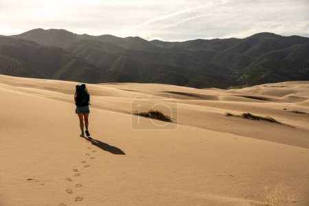 Photo for Woman Leaves Footprints on the Surface of Great Sand Dunes National Park - Royalty Free Image