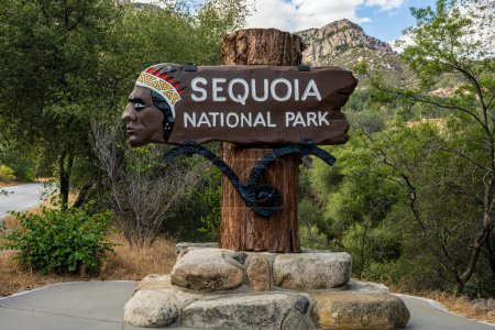 Photo for Sequoia National Park, United States: June 12, 2022: Sequoia National Park Sign At The Entrance shows an outdated image of a Native American - Royalty Free Image