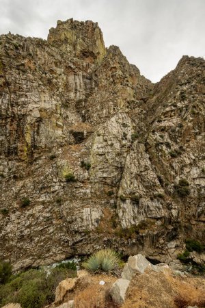 Photo for Carved Granite Wall of Kings Canyon With River Below on overcast day - Royalty Free Image
