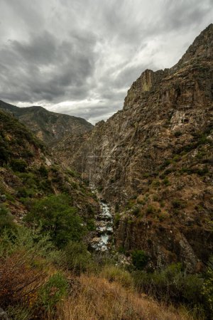 Photo for South Fork Of The Kings River Cuts Through Steep Canyon Walls on overcast day - Royalty Free Image