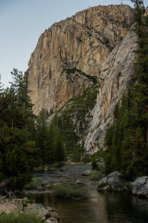 Photo for Large Granite Wall Stands Watch Over The Tuolumne River in Yosemite - Royalty Free Image