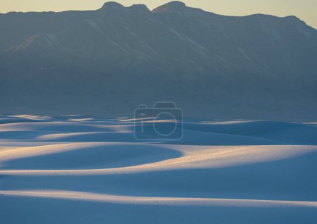 Photo for Sand Dunes Sit At The Base of Tall Mountains In White Sands National Park - Royalty Free Image