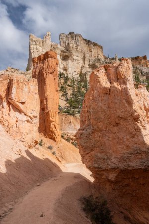 Peekaboo Trail Cuts Through Tall Boulders in Bryce Canyon