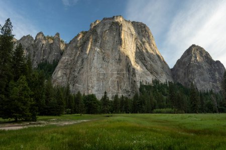 Sunlight Catches The Details Of Middle Cathedral Rock In Yosemite Valley in Summer