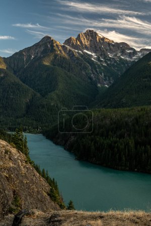 Last Sun Light Of The Day Clings To Colonial Peak Over Diablo Lake in the North Cascades