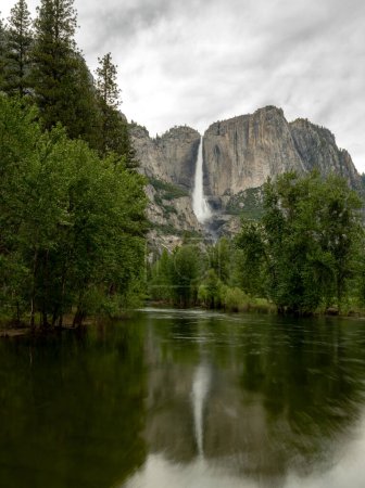 Yosemite Falls Refects In A Long Exposure of The Merced River in Yosemite National Park