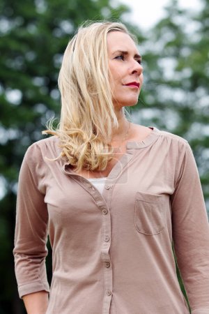 Photo for Portrait of a beautiful blond woman outside in nature - Royalty Free Image