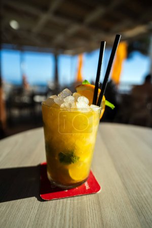 Mango mojito perfect summer drink with ice on top and lemon slice