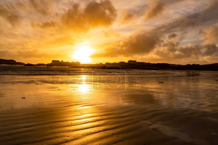Photo for Sunset on the beach at Rhoscolyn Isle of Anglesey North Wales - Royalty Free Image