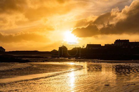 Photo for Sunset on the beach at Rhoscolyn Isle of Anglesey North Wales - Royalty Free Image