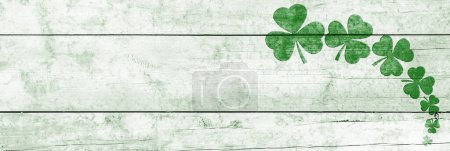 Photo for St Patricks day background. Shamrocks over a light green wood background. Decoration for St. Patrick's Day. Banner design - Royalty Free Image